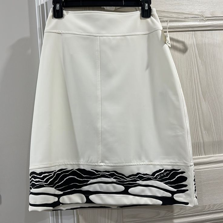 White Skirt White Pencil Mini Skirt For Day Out, White Relaxed Fit Midi Pencil Skirt, Casual White Pencil Skirt, White Pencil Skirt Skort For Summer, Chic White Relaxed Pencil Skirt, White Lined Midi Pencil Skirt, Elegant White Pencil Skirt For Day Out, White Flowy Lined Skort, White Pencil Skirt For Summer Day Out