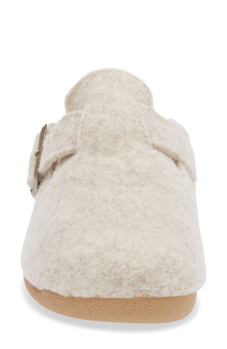 A soft wool-blend footbed enhances the everyday comfort of a clog slipper grounded by a sturdy rubber sole. Adjustable strap with buckle closure Wool and polyester upper and lining/rubber sole Made in Spain Comfortable Slip-on Slippers With Buckle Closure, Wool Clogs With Cushioned Footbed And Round Toe, Comfortable Flat Clogs With Buckle Closure, Beige Round Toe Mules With Buckle Closure, Beige Mules With Buckle Closure And Round Toe, Beige Outdoor Clogs With Cushioned Footbed, Comfortable Beige Clogs With Textured Footbed, Beige Cushioned Clogs For Outdoor, Beige Cushioned Outdoor Clogs