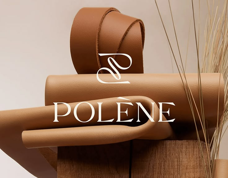 the logo for polene is displayed next to a plant with long grass in it