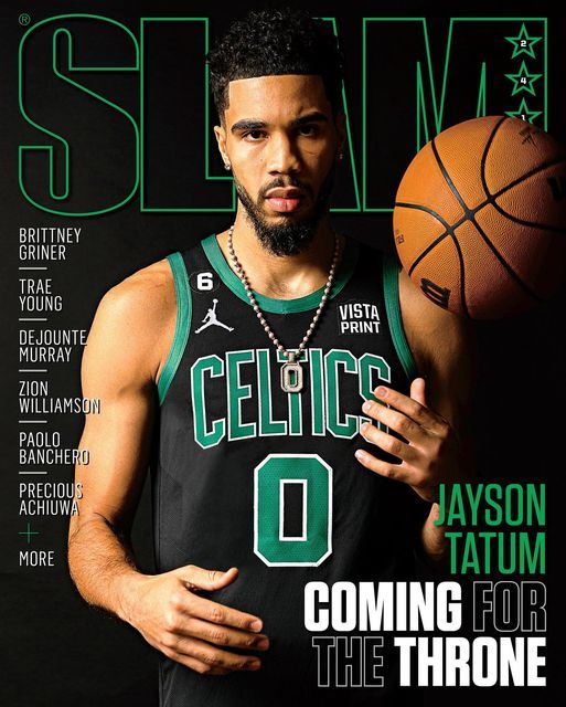 a man holding a basketball on the cover of slam magazine