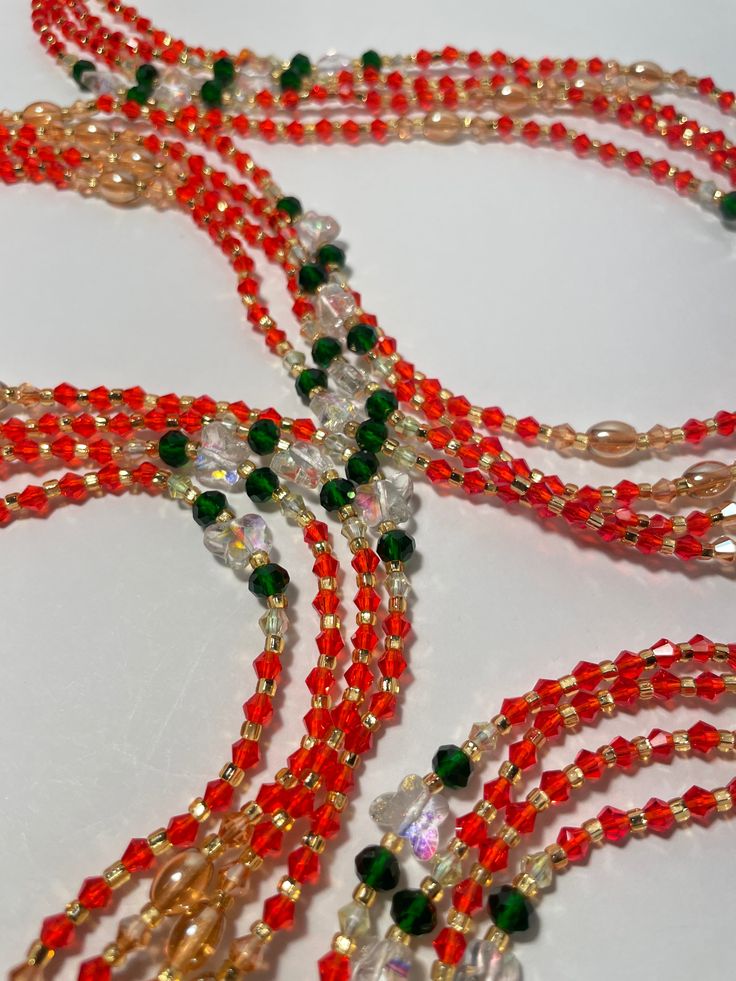 "Oupoyo" – a Single Strand Waist Bead that brings together the rich warmth of orange crystal glass seed beads, the captivating allure of emerald green crystal glass seed bead accents, and the subtle opulence of gold glass seed bead accents. ✨ Vibrant Orange Radiance: Oupoyo exudes a radiant glow with its vibrant orange crystal glass seed beads, reflecting the energy of the sun and infusing your ensemble with a lively and spirited charm. 🌿 Emerald Green Elegance: Accentuating the design are emer Emerald Green Crystal, Strong Hand, Orange Crystals, Green Crystal, Glass Seed Beads, Gold Glass, Vibrant Orange, Green Crystals, Deep Green