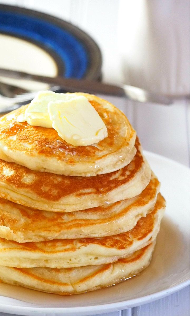 a stack of pancakes with butter on top