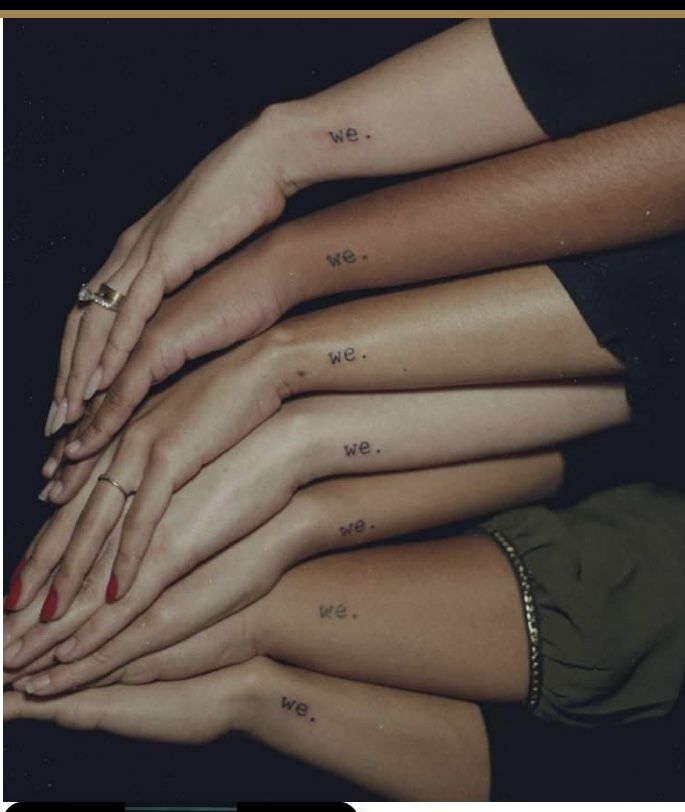 four girls with matching tattoos on their arms