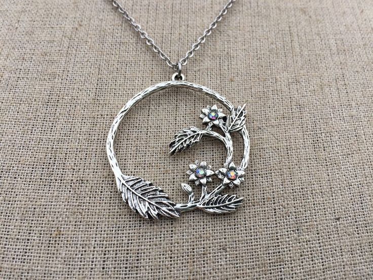 "Isn't this pendant necklace stunning and unique? I just love the details and whimsical nature of it! It has a rustic yet sophisticated vibe to it and has eye catching crystals the accentuate the little flowers. The earrings measure 1 1/2\" long by 1 3/8\" wide. They hang from simple silver ear wire hooks. Overall drop length is about 1 5/8\". Made from allergy free plated silver and crystals. I have a matching necklace my shop, if you would like the whole set. Here is the link https://etsy.me/2 Whimsical Round Beads For Jewelry Making, Nature-inspired Round Jewelry For Crafting, Nature-inspired Round Necklaces For Jewelry Making, Nature-inspired Round Pendant Jewelry For Crafting, Whimsical Adjustable Round Pendant Necklace, Nature-inspired Nickel-free Jewelry With Round Pendant, Whimsical Round Pendant Necklace, Whimsical Silver Round Pendant Jewelry, Whimsical Pendant Necklaces For Jewelry Making