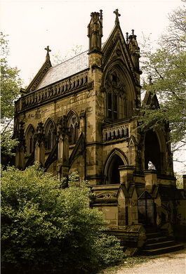 an old church with steeple and stone stairs in the foreground, surrounded by trees