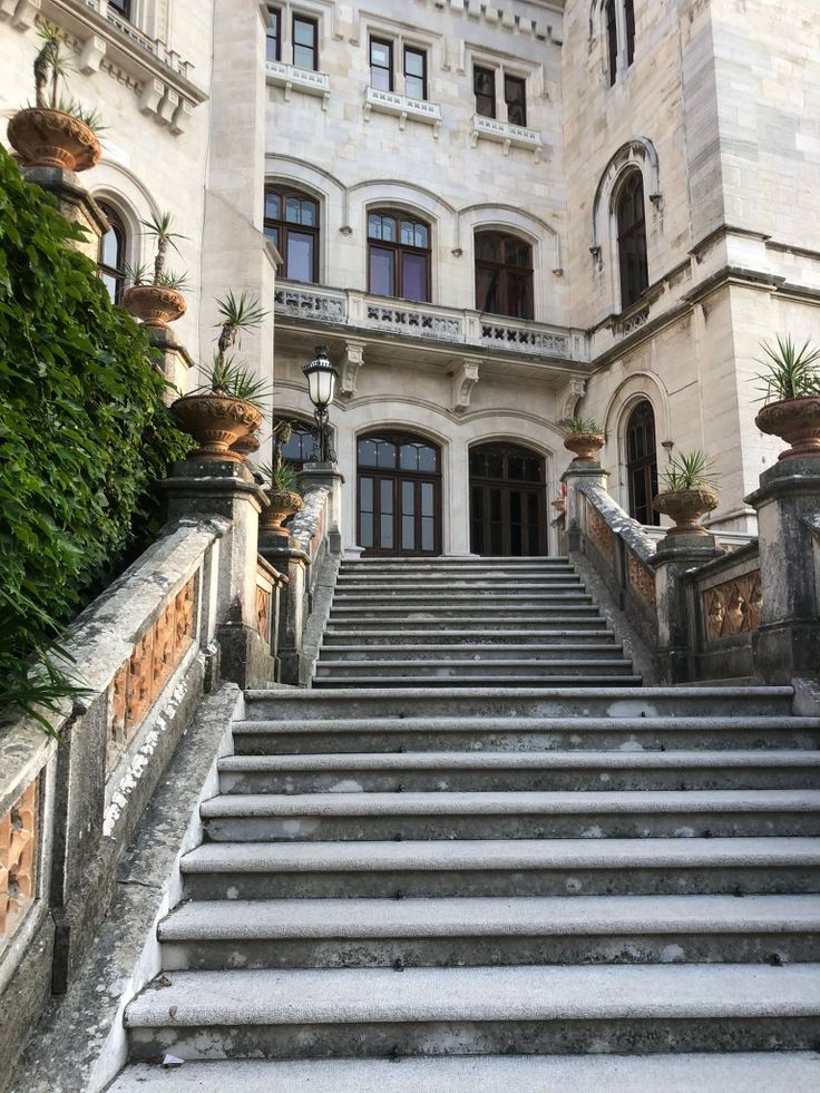 an old building with stairs leading up to it