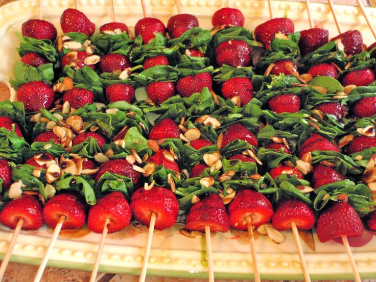 strawberries and spinach on skewers in an oven