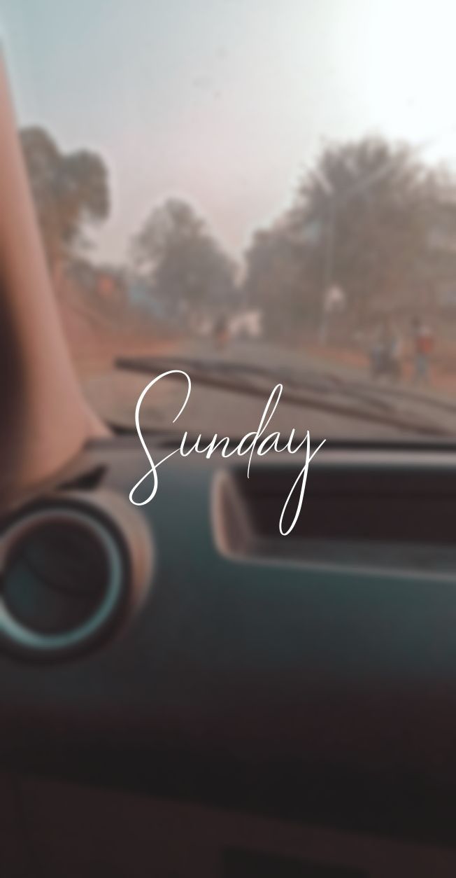 the dashboard of a car that is sitting in front of a window with the words sunday written on it