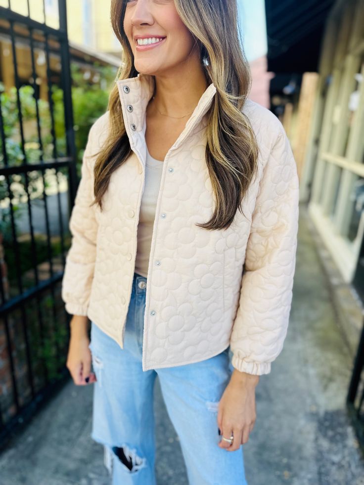 This cute beige jacket boasts a charming floral quilted pattern and playful button down style. Stay cozy and stylish in this unique piece! Fit: True to size. Fabric: 100% polyester Fall Quilted Button-up Jacket With Snap Buttons, Cream Quilted Long Sleeve Outerwear, Cream Casual Puffer Jacket For Fall, Casual Cream Puffer Jacket For Fall, Trendy Beige Button-up Outerwear, Cream Outerwear With Button Closure For Day Out, Cream Outerwear For Winter Day Out, Cream Winter Outerwear For Day Out, Spring Beige Outerwear With Buttons