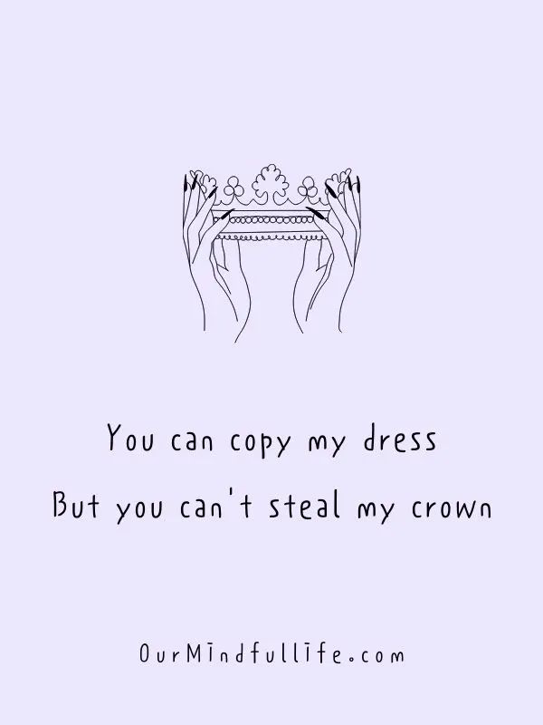 two hands holding a table that says you can copy my dress but you can't steal my crown