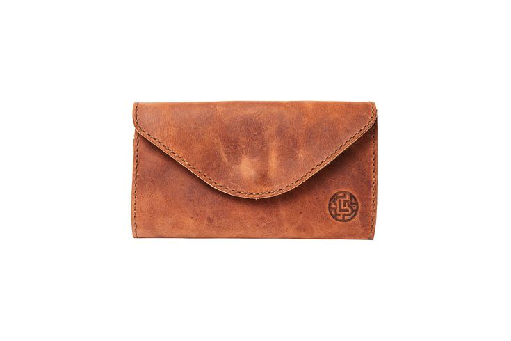 Our women's wallet is large enough for all your cards, cash and coins but not too big for your favorite crossbody purse. The snap closure keeps everything secure and the beautiful leather will only get better over time! Product Details 100% genuine leather Handcrafted in Honduras One interior pocket for cash, six card slots and a change pocket with zipper Magnetic snap closure Dimensions: 4.5"H x 8.5"W x 1"D All finishes are high quality. This is a handmade leather item, and by nature, there are Envelope Coin Purse For Everyday Use, Classic Trifold Wallet With Cell Phone Pocket For Everyday, Leather Coin Purse For Everyday Use, Classic Clutch With Cell Phone Pocket For Everyday Use, Everyday Leather Trifold Wallet With Cell Phone Pocket, Classic Wallets With Magnetic Closure For Everyday, Classic Wallet With Magnetic Closure For Everyday, Classic Leather Wallets With Cell Phone Pocket, Leather Envelope Coin Purse For Everyday