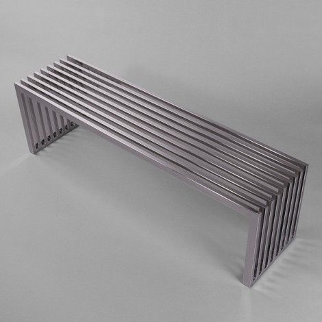 a metal bench sitting on top of a white floor