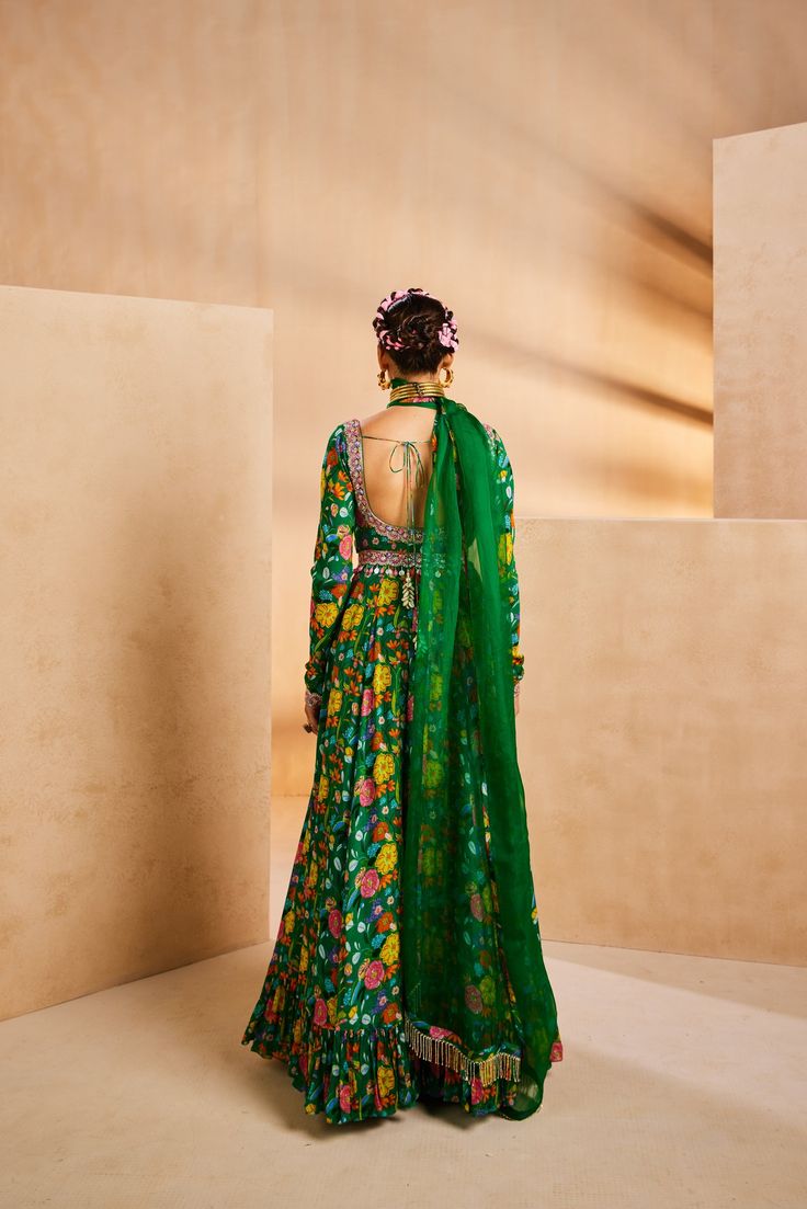 Featuring a ruffle Anarkali in an eclectic hand-painted printed floral pattern. It features a hand-embroidered neckline and belt. The belt features colourful stone drops and the dupatta is accentuated with metallic cutdana fringes.From Aneesh Agarwaal's Seher collection.DELIVERY TIMEPlease allow 8-12 weeks for your outfit to arrive.FABRIC DETAILSChinon, OrganzaProfessional cleaning only. Green Anarkali, Embroidered Neckline, 12 Weeks, Body Measurements, Anarkali, Stone Color, Hand Embroidered, Floral Pattern, Hand Painted