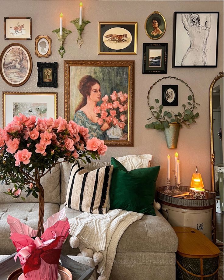 a living room filled with furniture and pictures on the wall