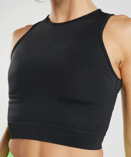 Gymshark Sweat Seamless Midi Tank - Black | Gymshark Seamless Athleisure Tops For Layering, Modern Seamless Solid Tops, Modern Seamless Solid Color Tops, Functional Seamless Black Tops, Functional Black Seamless Tops, Functional Black Tops With Seamless Design, Functional Black Top With Seamless Design, Modern Black Seamless Tops, Supportive Seamless Stretch Tops