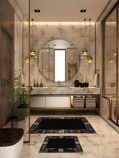 a bathroom with marble walls and flooring is shown in this image, there are two rugs on the floor