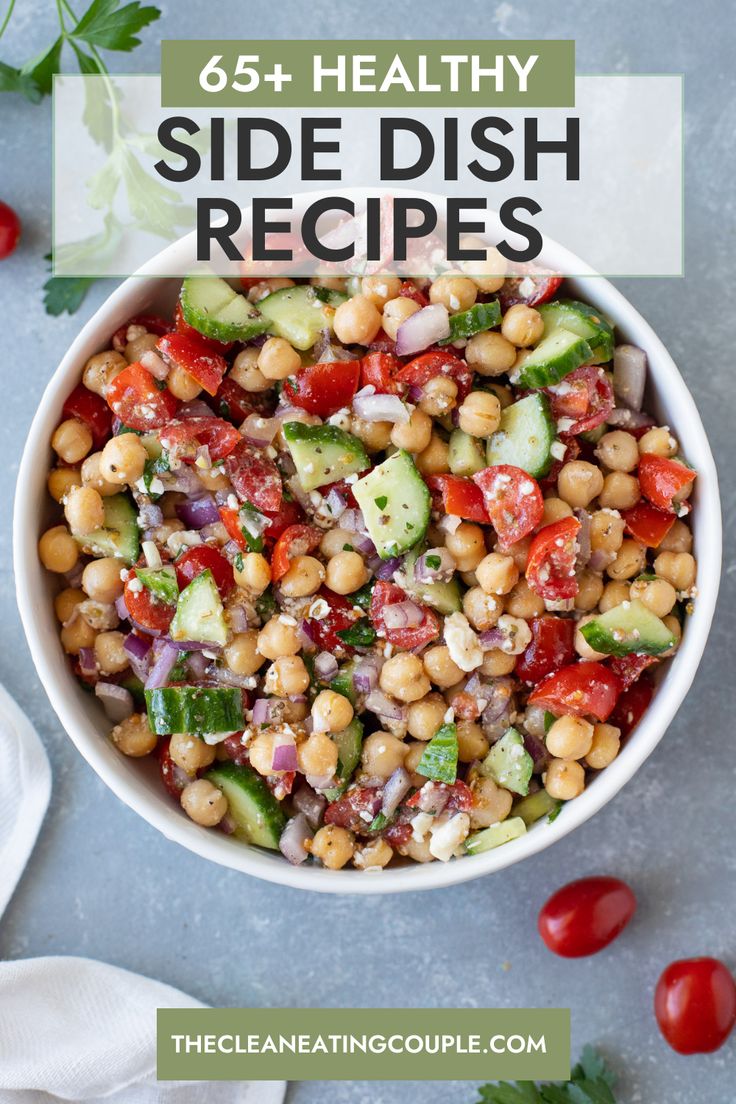 a white bowl filled with chickpeas, cucumber and red onion salad