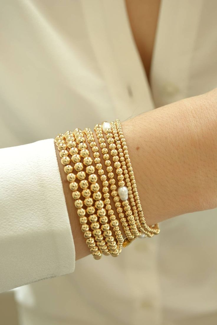 **ANNIVERSARY MONTH SALE UP TO 20% OFF ON SELECTED ITEMS OR BUY ANY THREE (3) ITEMS AND GET 15%OFF ON YOUR ENTIRE PURCHASE ** Gold Bead Bracelet, Beaded Bracelet, Gold Bracelet Stack, Stacking Bracelet 2mm 3mm 4mm, Dainty Bracelet Classic gold bead bracelet is a perfect addition to a dainty stack this spring/summer season. The beads are strung on a premium stretch cord. SOLD BY ONE BRACELET ITEMS DETAILS: Water Resistant -Nickel-free - Allergy-free - - High-Quality 18K gold plated brass beads ma Stackable Pearl Bead Bracelet As A Gift, Stackable Round Bead Pearl Bracelet As Gift, Stackable Pearl Bracelet With Round Beads As Gift, Gift Stackable Pearl Bracelet With Round Beads, Stackable Round Bead Pearl Bracelet For Everyday, Stackable Pearl Bracelet With Round Beads, Dainty Stackable Round Bead Bracelets, Dainty Hand-strung Bracelets With Round Beads, Dainty Bracelet With Spacer And Round Beads