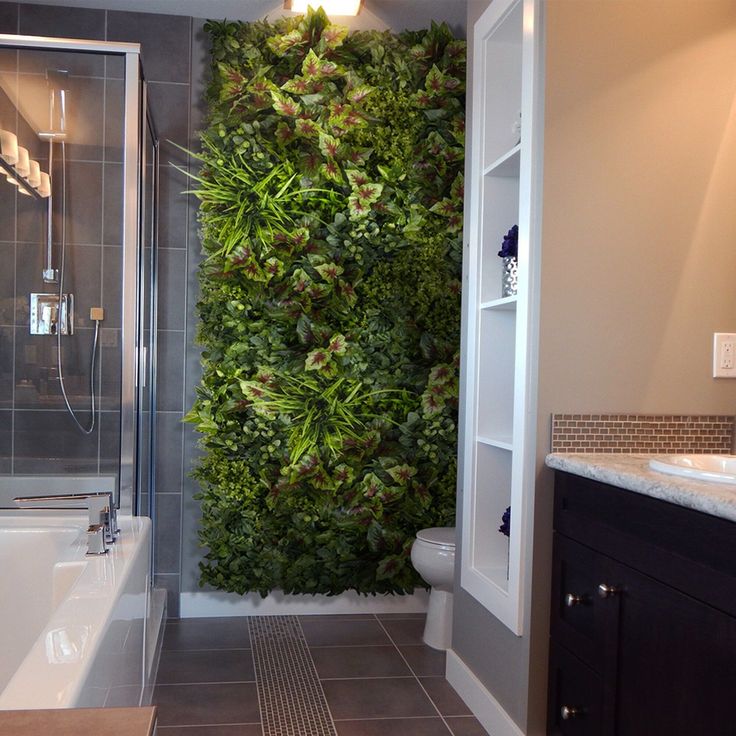 a bathroom with a green wall in the shower