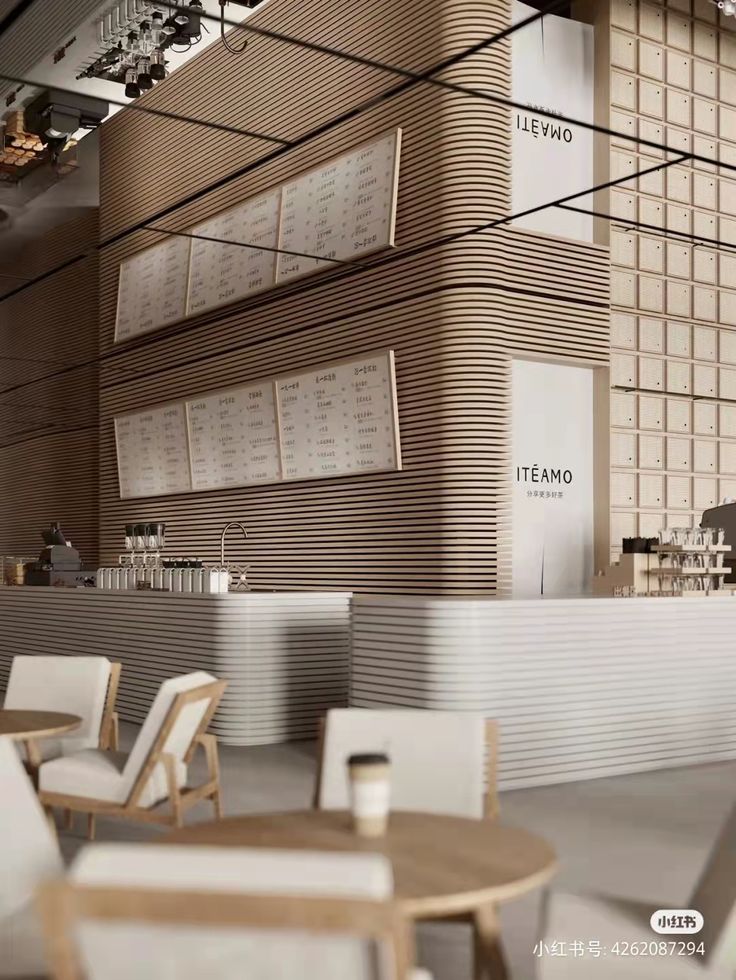 the interior of a restaurant with tables, chairs and menu boards on the wall above them