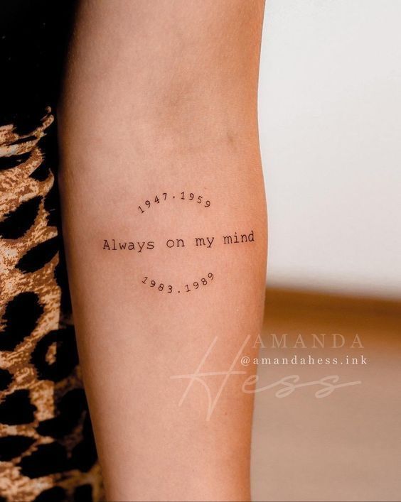 a woman with a tattoo on her arm that says, i'm not always on my mind