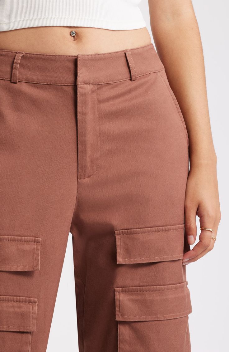 These trend-right pants are crafted from a durable cotton blend with cargo pockets for a utilitarian vibe. 32" inseam; 21" leg opening; 12" front rise; 14 1/2" back rise (size 29) 49% cotton, 48% lyocell, 3% spandex Machine wash, line dry Imported Fitted Cargo Pants With Cargo Pockets For Workwear, Fitted Cotton Bottoms With Flap Pockets, Cotton Cargo Shorts With Multiple Pockets For Workwear, Fitted Cotton Bottoms With Multiple Pockets, Fitted Cotton Cargo Pants With Flap Pockets, Mid-rise Cotton Utility Cargo Pants, Fitted Cotton Cargo Shorts With Pockets, Cotton Cargo Shorts With Pockets For Work, Mid-rise Cotton Cargo Jeans For Work