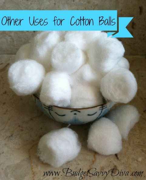 a bowl filled with cotton balls sitting on top of a counter