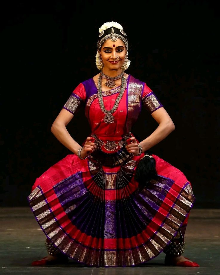 a woman in a red and purple dress