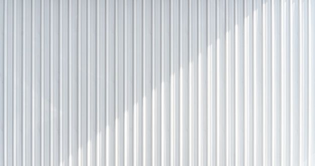 a white wall with vertical lines on it