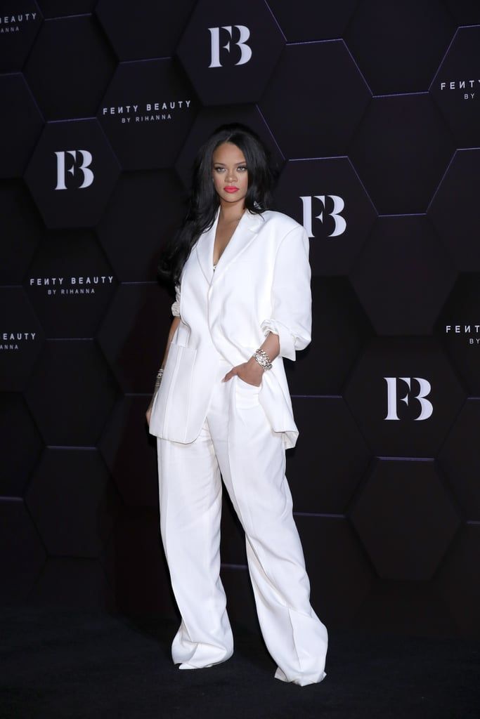 an image of a woman in white suit posing on the red carpet at fen fen fen fen