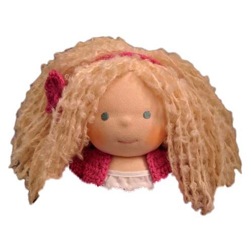 a doll with blonde hair wearing a pink hat and red scarf on it's head