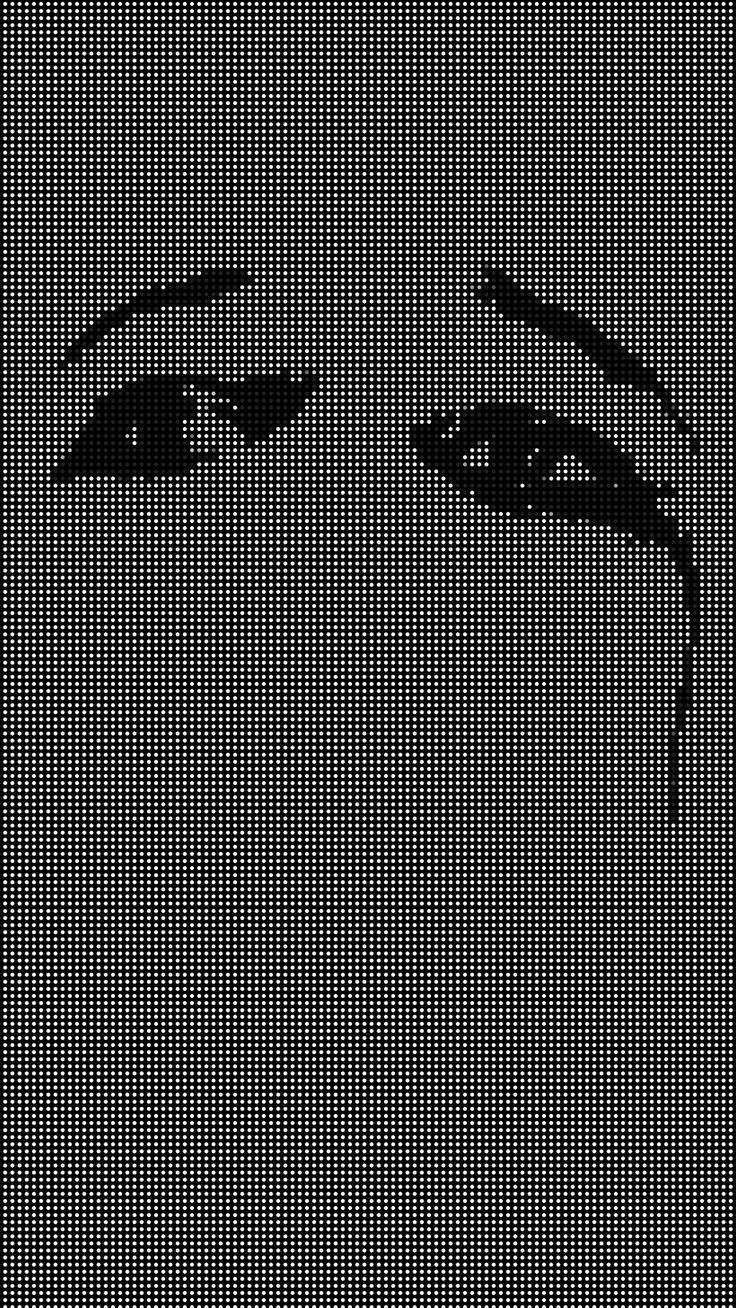 an image of a woman's face made up of squares and dots in black