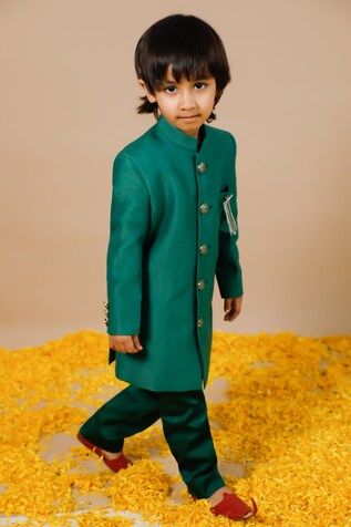 Green full sleeve jodhpuri with mandarin collared neckline and silver brooch pin on the left pocket. Paired with pant. - Aza Fashions Green Long Sleeve Bandhgala With Zari Work, Festive Cotton Long Sleeve Bandhgala, Festive Long Sleeve Cotton Bandhgala, Festive Long Sleeve Winter Sets, Long Sleeve Nehru Jacket For Diwali, Festive Long Sleeve Green Nehru Jacket, Fitted Green Kurta For Winter, Green Cotton Long Sleeve Sherwani, Festive Long Sleeve Bandhgala For Celebrations