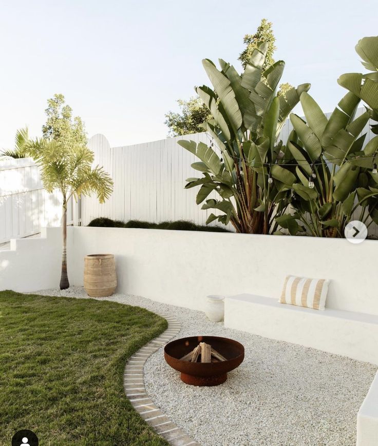 an outdoor living area with grass and plants