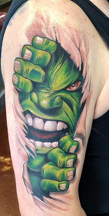 a woman with a green tattoo on her arm