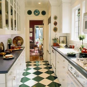 a kitchen with black and white checkered flooring next to a stove top oven