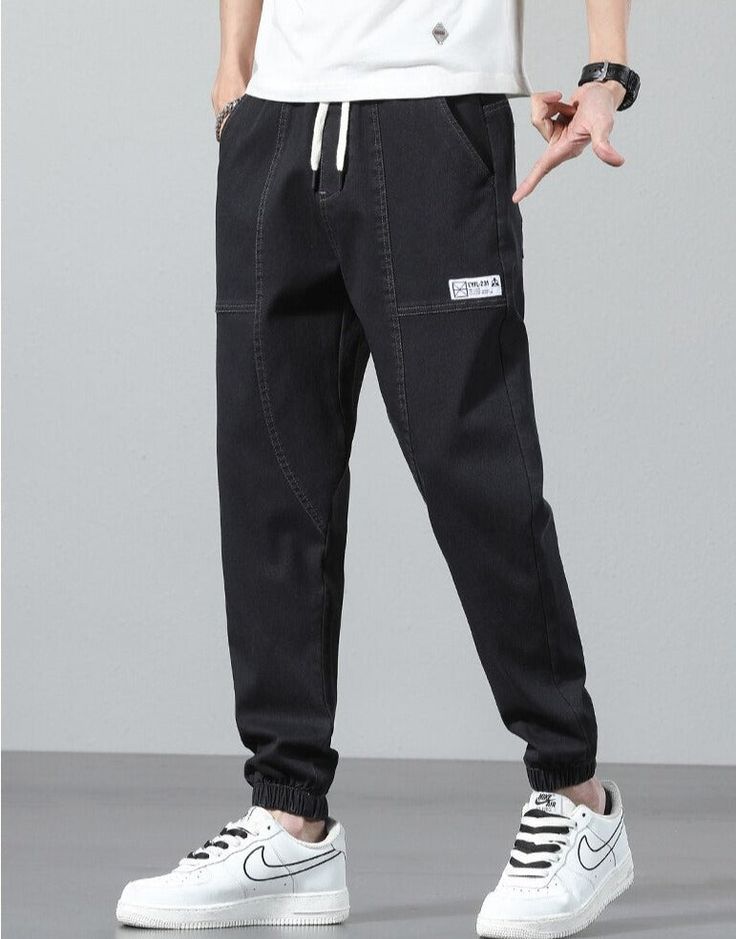 Vinny Denim Joggers are a pair of men's relaxed fit jogging pants that can pair with a streetwear or workout outfit. Featuring a relaxed fit, these joggers offer maximum comfort for men who want to feel comfortable all day long. Available in the following variants: Black, Blue, Grey Material: Cotton & Denim Style: Casual / Smart Casual Season: all seasons Gender: MEN Feature: Breathable/Comfortable, Stretched Size chart in CM Size chart in INCH Casual Tapered Leg Cargo Jeans For Streetwear, Urban Cotton Joggers With Straight Leg, Urban Cotton Straight Leg Joggers, Urban Tapered Leg Joggers For Streetwear, Casual Relaxed Fit Joggers For Streetwear, Casual Straight Leg Joggers With Pockets, Casual Cotton Straight Leg Joggers, Sporty Denim Jeans For Streetwear, Urban Style Baggy Straight Leg Joggers