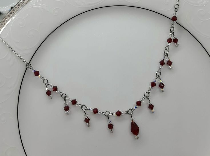 This gorgeous necklace is made with Swarovski Crystals and is designed to catch the light with every movement. Available in Red/White or Red/Black Goth Heart Necklace, Red Black Beaded Necklace, Black Dress Red Jewelry, Wire Jewellery Necklaces, Handmade Gothic Jewelry, Black And Red Necklace, Red And Black Necklace, Red Jewellery, Red Crystal Necklace