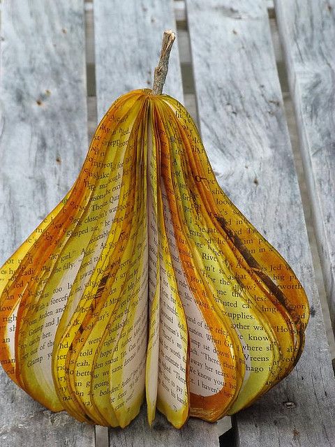 a book page pear sitting on top of a wooden table