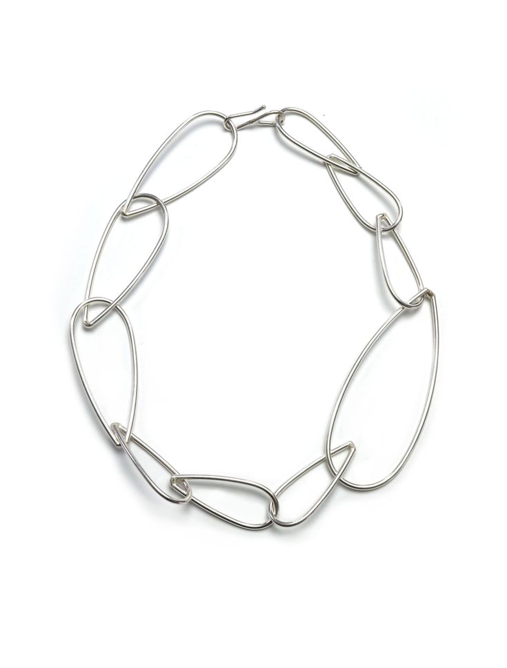 One big link punctuates this necklace for a stunning modern, minimal, easy to wear statement necklace. Wear it on its own or link and layer with other pieces in the Modular Collection for endless possibilities! Handmade in silver. Features an s-hook style clasp. Also available in steel and bronze. Necklace is approximately 19" long. The biggest links are 1 1/4" wide. Need more length? Check out our chain extenders. Comes in a gift box, tied with a ribbon. Treat yourself or a loved one! Made to order: please allow 2-3 days for your necklace to ship. FREE shipping on all US orders over $125! Minimalist Sterling Silver Chunky Chain Jewelry, Simple Silver Chain Necklace For Everyday, Silver Simple Chain Necklace For Everyday, Minimalist Silver Necklace With Oval Link, Minimalist Silver Oval Link Necklace, Minimalist Chunky Chain Oval Link Jewelry, Minimalist Chunky Chain Jewelry With Oval Links, Minimalist Silver Link Necklace, Minimalist Metal Oval Link Necklace