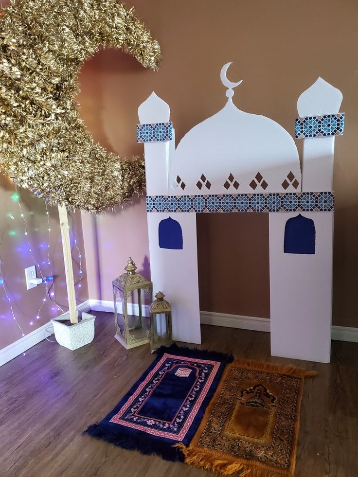 a room with a carpet, rugs and decorations on the floor in front of it