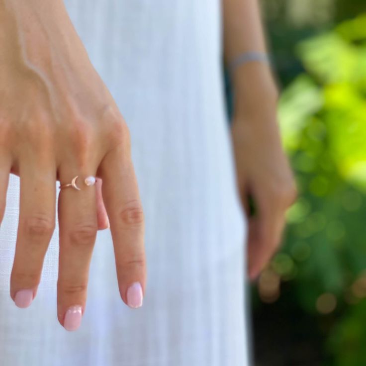 Sun and Moon Ring | Channel the power of the moon with this authentic moonstone ring. Handcrafted in 14K rose gold over sterling silver. It features an open shank sun & moon ring design and will be a wonderful addition to your ring collection. A luminous rainbow moonstone symbolizes inner growth and strength. Wear it to promote inspiration, intuition and empathy. Celestial Everyday Adjustable Rings, Adjustable Celestial Rings For Everyday Wear, Everyday Adjustable Celestial Rings, Adjustable Moon Shaped Jewelry For Everyday, Elegant Crescent Moon Charm Rings, Everyday Moon-shaped Jewelry, Dainty Moon-shaped Midi Promise Rings, Minimalist Crescent Moon Charm Ring, Minimalist Adjustable Crescent Ring