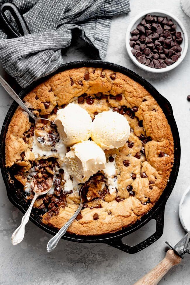 a skillet cake with ice cream and chocolate chips