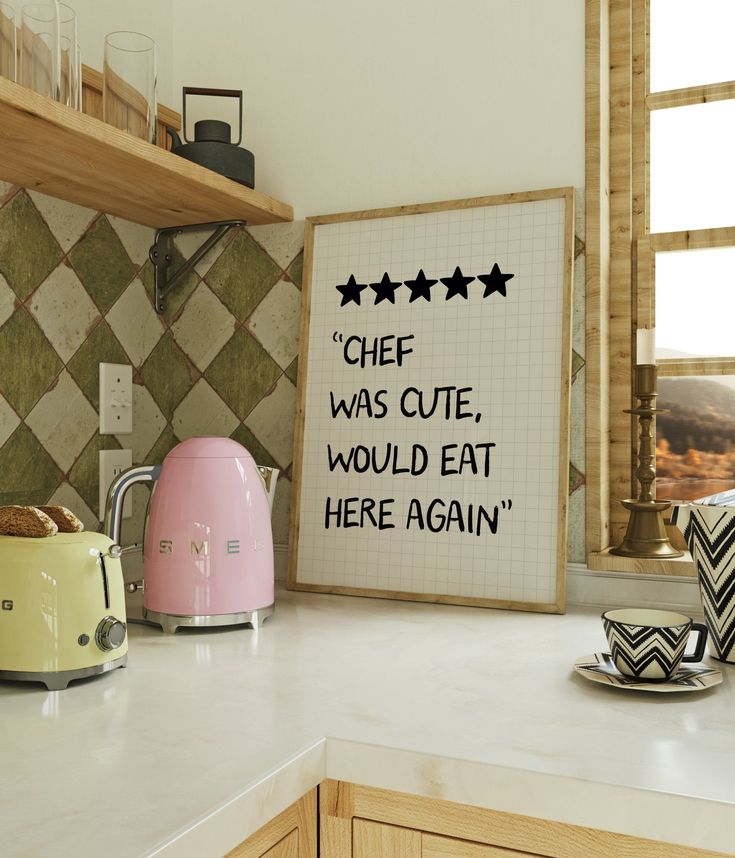 a kitchen counter with toasters, kettles and a sign that says chef was cute, would eat here again