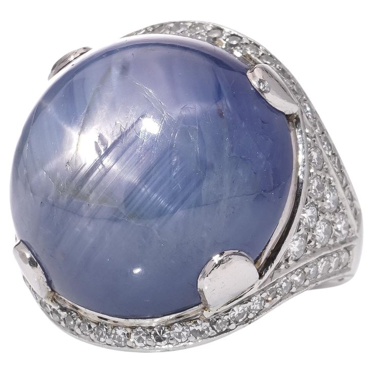 Platinum ladies' dome ring with approximately 46 cts. of round cabochon sapphire and diamond ring. X - Ray has been tested positive for platinum purity. Dimensions - Finger Size (UK) = H (EU) = 47 (US) = 4 Weight: 19 grams Ring Size: 2.9 x 2.4 x 1.8 cm Cabochon star sapphire - Quantity of stones: 1 Cut: Round Carat weight: approx. 46.00 carats Treatment: Natural, treatment is not indicated. Diamonds - Quantity of stones: 70 Cut: Round Brilliant. Carat weight: 46 x 0.01 carats 24 x 0.03 carats Total carat weight: 1.18 carats Clarity: SI1 Colour: G - H Condition: The ring is pre - owned, with minor signs of usage, good and pleasant condition overall. Sapphire And Diamond Ring, Dome Ring, Star Sapphire, Domed Ring, Round Brilliant, Fashion Rings, Diamond Ring, Platinum, Jewelry Rings