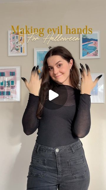 a woman is making evil hands for halloween