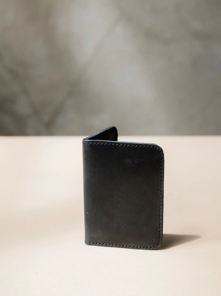 Introducing the ABLE Freddie Card Wallet in sleek black leather. Stay organized and stylish with this functional yet fashionable wallet. Perfect for keeping your cards and cash in one place on-the-go. The Freddie Card Wallet - Black Bifold Wallet With Interior Card Slots, Black Bifold Card Holder, Black Trifold Wallet With Coin Pocket For Everyday, Black Bifold Wallet For Everyday Use, Black Bifold Wallet For Daily Use, Black Bifold Card Holder For Everyday Use, Modern Black Wallets With Card Slots, Black Trifold Wallet With Card Slots For Everyday, Modern Black Wallets With Interior Card Slots