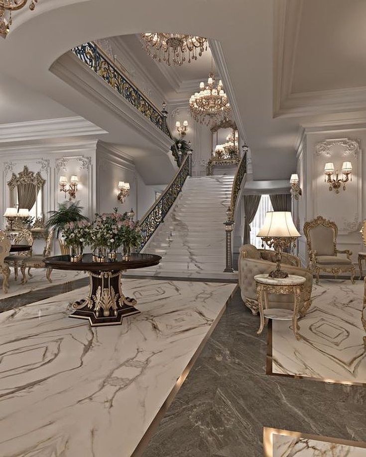 an elegant living room with chandeliers and marble floors