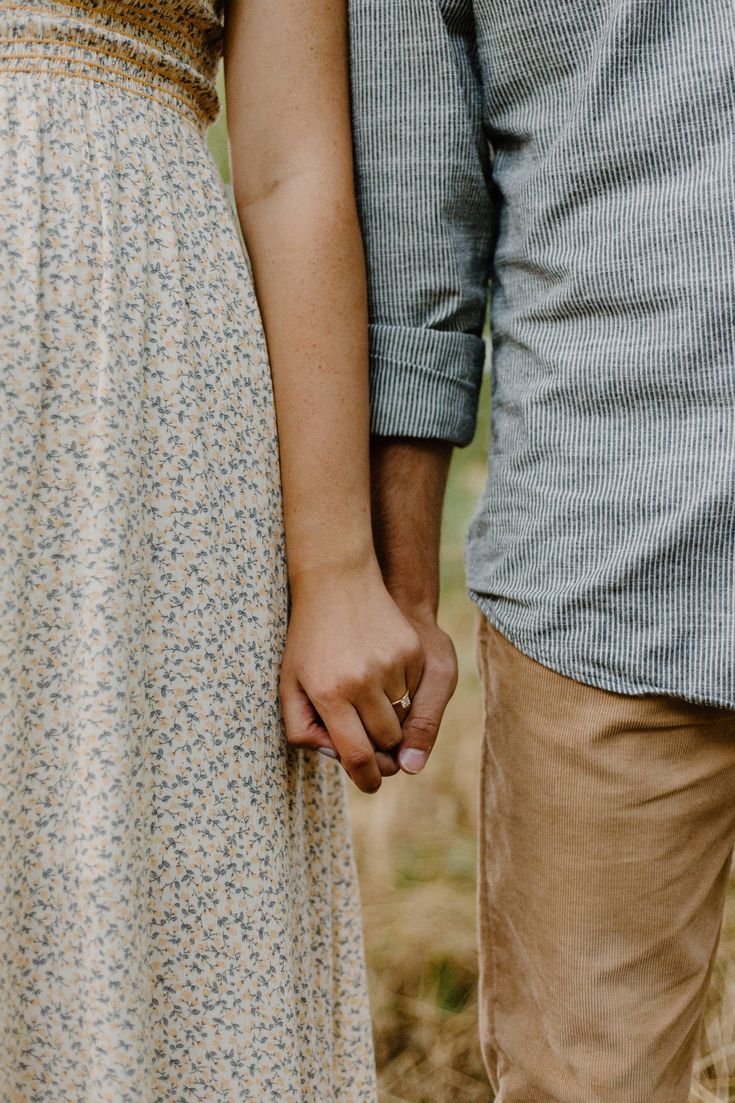 an image of a couple holding hands