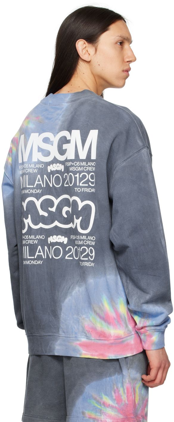 French terry sweatshirt. Tie-dye pattern printed throughout. · Rib knit crewneck, hem, and cuffs · Logo printed at front · Logo and text printed at back Part of the MSGM x Burro Studio collaboration. Supplier color: Multicolor Oversized Sweatshirt With Logo Lettering For Streetwear, Oversized Cotton Sweatshirt With Logo Lettering, Relaxed Fit Crew Sweatshirt With Logo Lettering, Cotton Sweatshirt With Logo Lettering In Relaxed Fit, Cotton Sweatshirt With Relaxed Fit And Logo Lettering, Relaxed Fit Cotton Sweatshirt With Logo Lettering, Oversized Crew Neck Sweatshirt With Logo Lettering, Oversized Graffiti Print Sweatshirt With Crew Neck, Oversized Cotton Sweatshirt With Graffiti Print